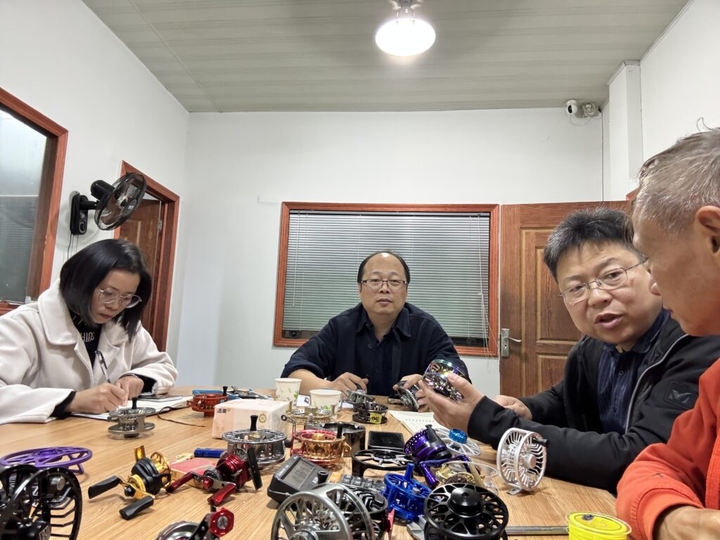 Meeting with the reel engineer at the factory during euro-nymphing reel development