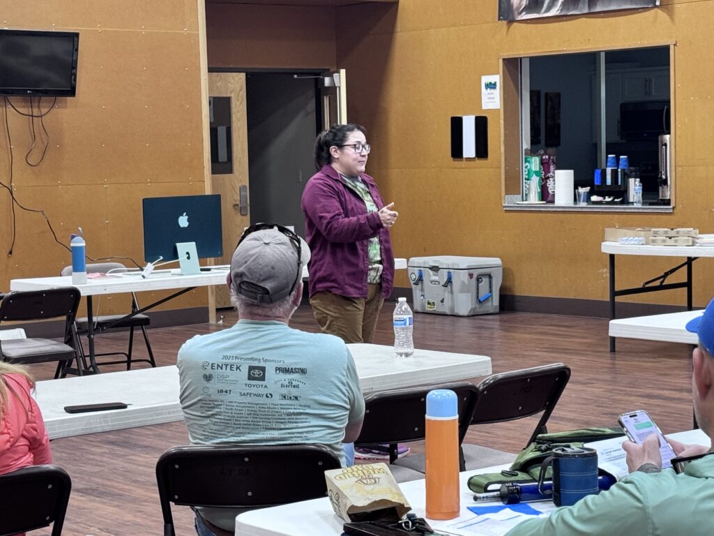 Amanda Hoffner presenting during the 2026 Oregon Tenkara Bug Out seminar in La Pine, Oregon, sharing event information and welcoming participants.